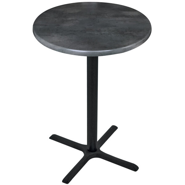 A Holland Bar Stool black steel round table with a black base.