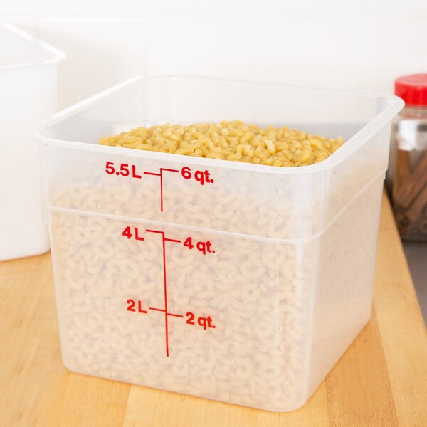 A translucent plastic Cambro food storage container with measurements on the side.
