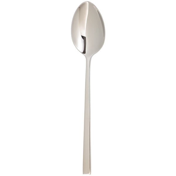 An Arcoroc stainless steel teaspoon with a long handle.