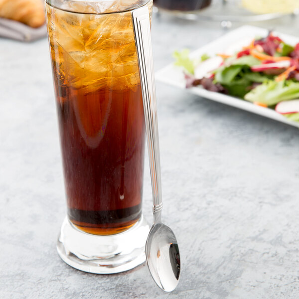 A glass of iced tea with a Libbey stainless steel iced tea spoon in it.