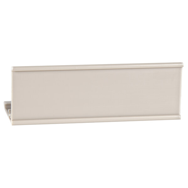 A white rectangular object with a clip on a white background.