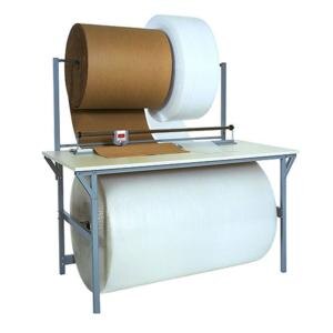 A Bulman packing table with a large roll of paper.