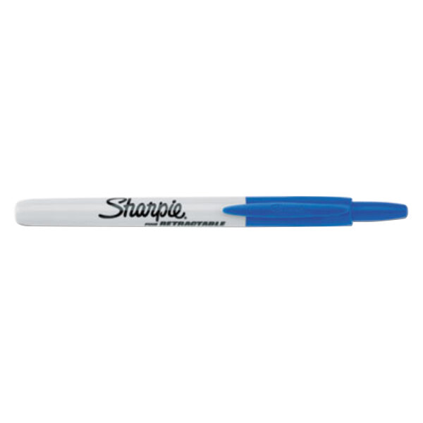 A close-up of a blue Sharpie retractable pen with white accents.