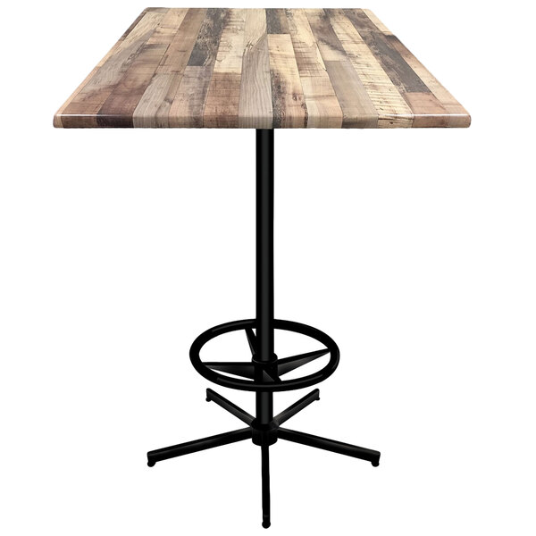 A wooden bar table with a metal foot rest base.