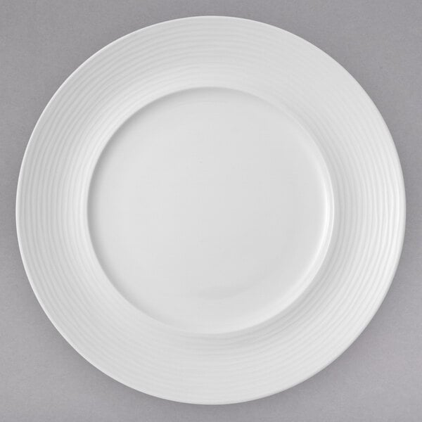 A white Villeroy & Boch porcelain plate with a thin rim and a circular pattern.