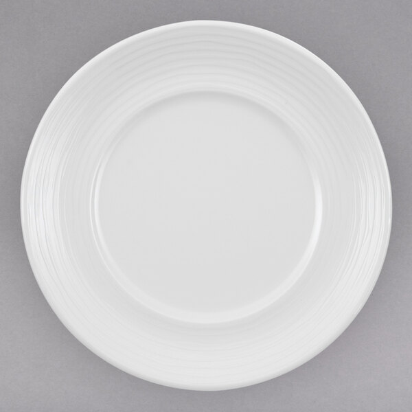 A white Villeroy & Boch porcelain plate with a curved edge.