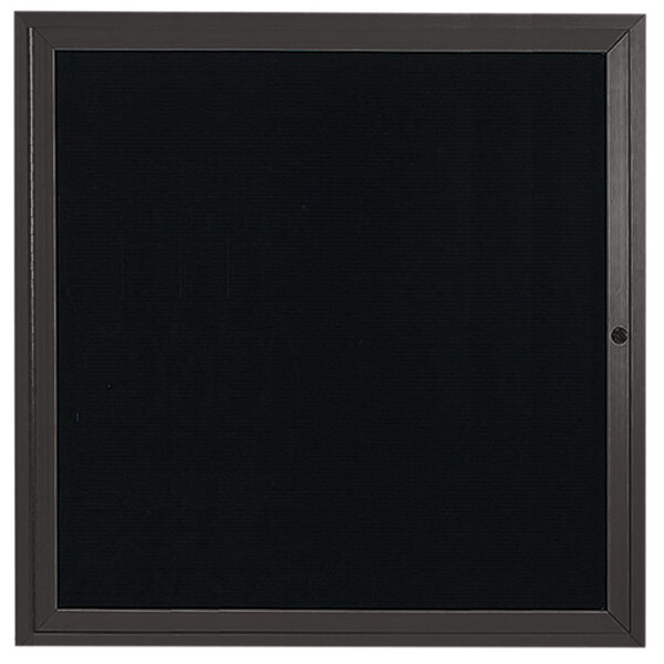 An enclosed black letter board with a black frame.