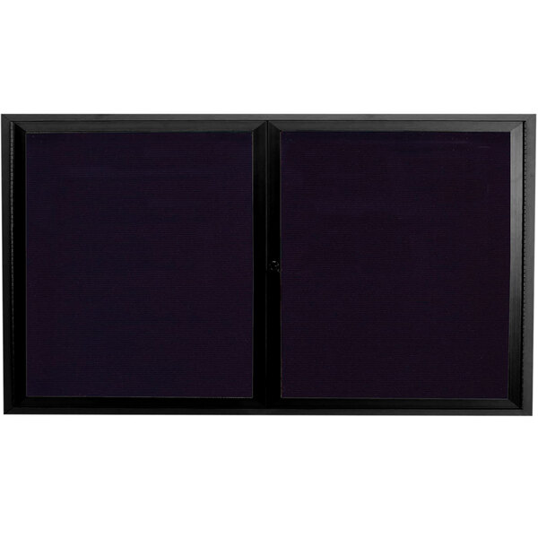 A black rectangular Aarco message center with two black framed glass doors.