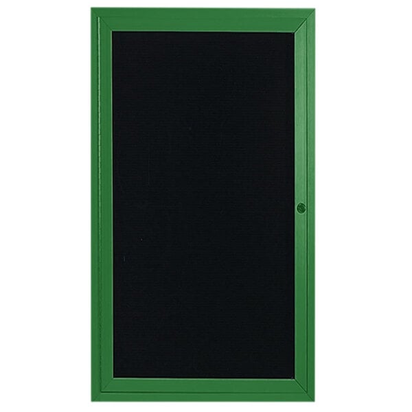 A black board with a green frame and a black letter board behind a green framed door.