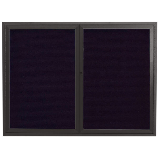 A black framed rectangular bulletin board with two black doors.