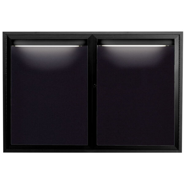 A black rectangular window with lights on the inside.