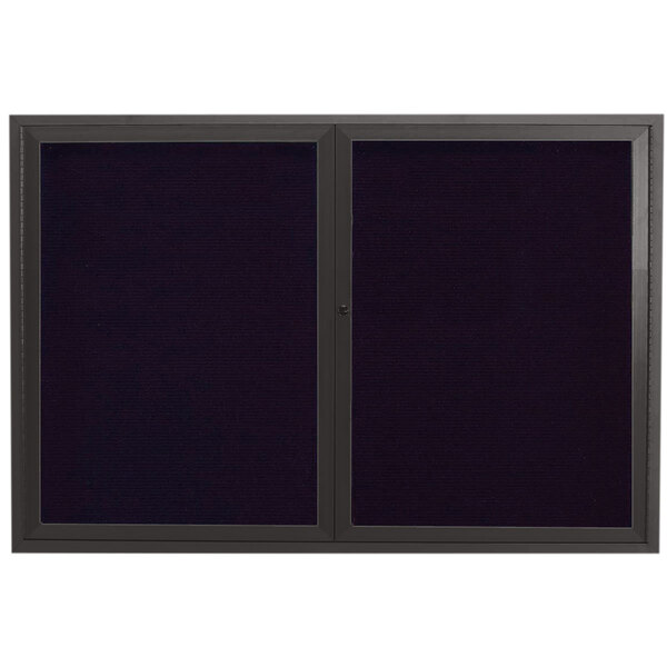 A black rectangular Aarco message center with a black metal frame and two black doors.