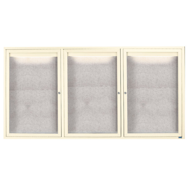A white Aarco cabinet with three glass doors.