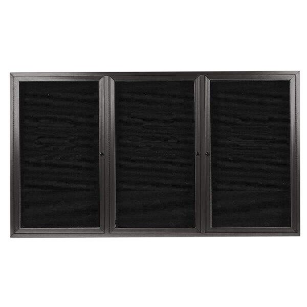 A black rectangular cabinet with three black glass doors.