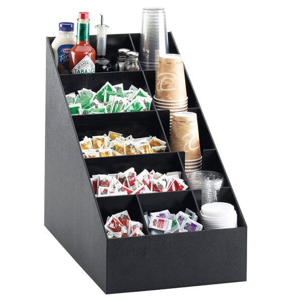 A black Cal-Mil countertop organizer with cups and condiments.