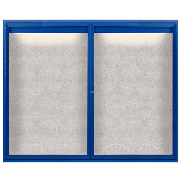 A blue bulletin board cabinet with two white enclosed doors with windows.