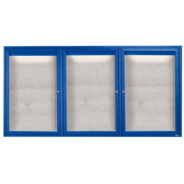 A blue cabinet with three white glass doors with blue frames.