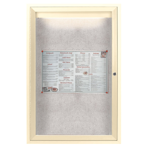 An ivory bulletin board cabinet with a menu in a glass case.