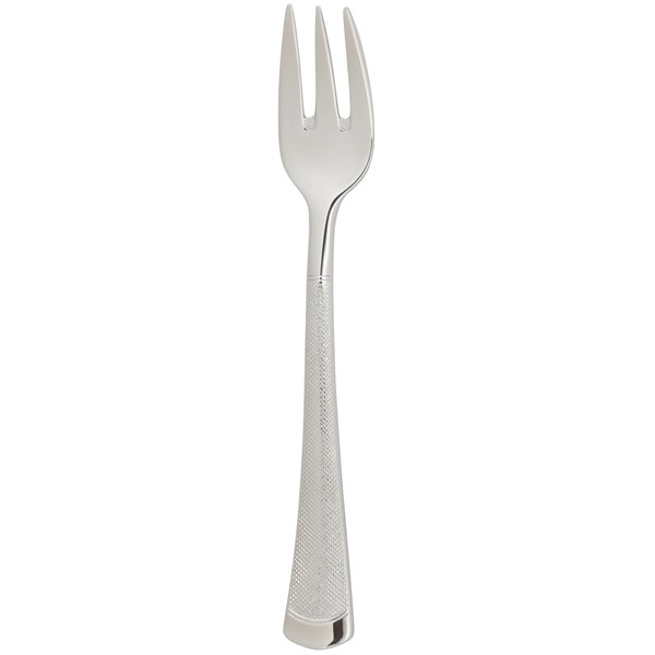 An Arcoroc stainless steel cocktail/oyster fork with a white background.