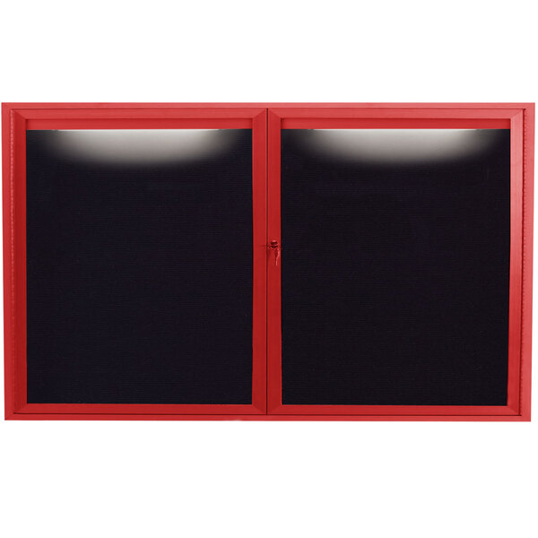 A red aluminum message center with black letter board panels behind glass doors.