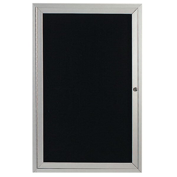 An enclosed satin anodized aluminum door with a black board with silver trim.