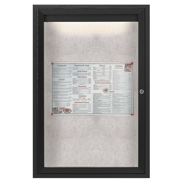 A black framed menu board with a menu inside.