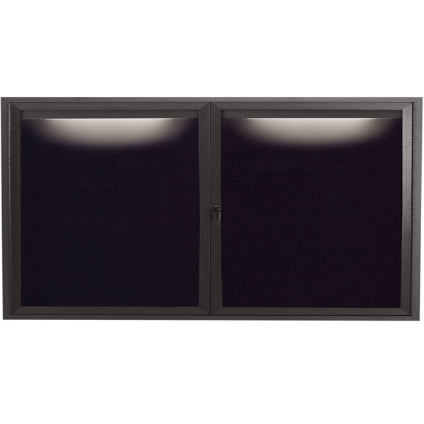 A black rectangular frame with a light on it and a black rectangular window with a black screen.