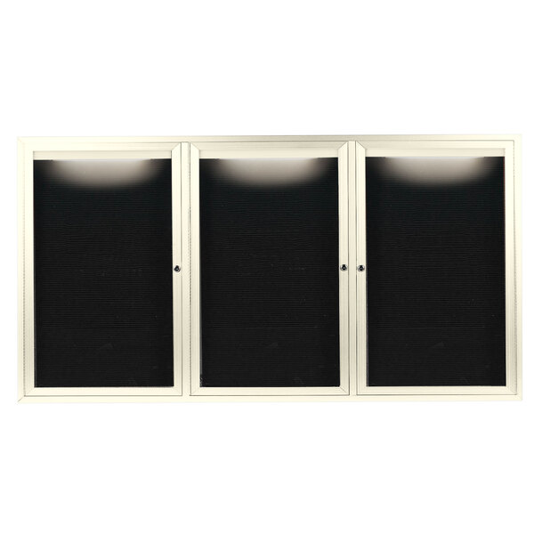 A white cabinet with black rectangular doors with glass panels.