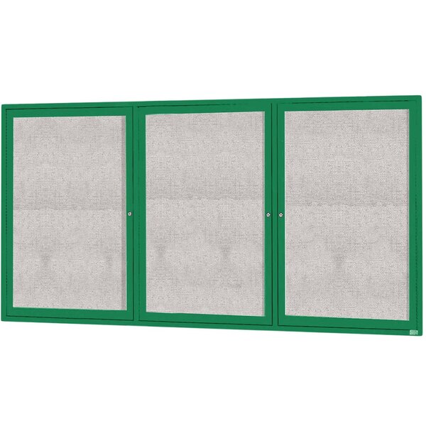 A white and green board with three green doors with glass panels.