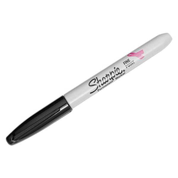 A close-up of a black Sharpie with pink writing and a pink ribbon.