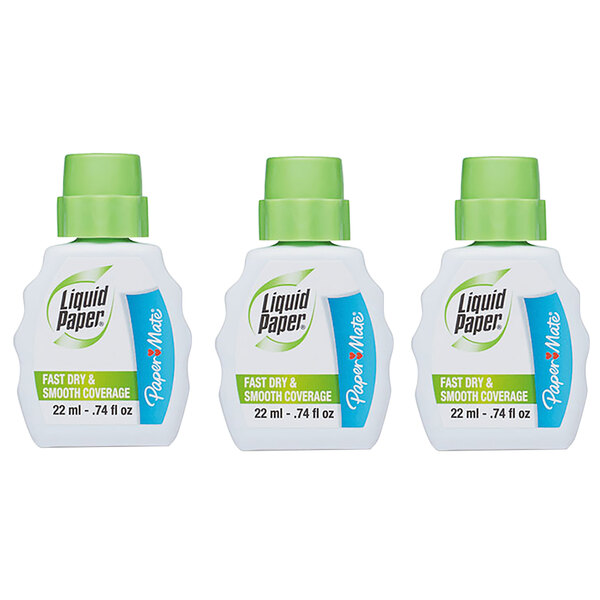 A three pack of white Paper Mate Liquid Paper bottles with green caps.
