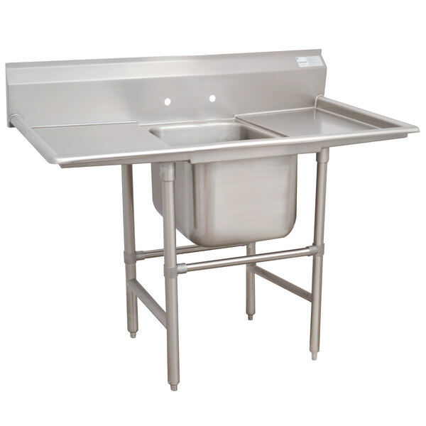 An Advance Tabco stainless steel one compartment pot sink with two drainboards.