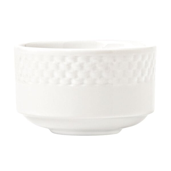 A close up of a Libbey Lunar Bright White Porcelain Bouillon bowl with a pattern on it.