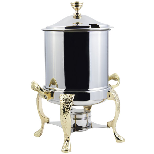 A silver stainless steel Bon Chef Marmite chafer with brass accents and a hinged top.