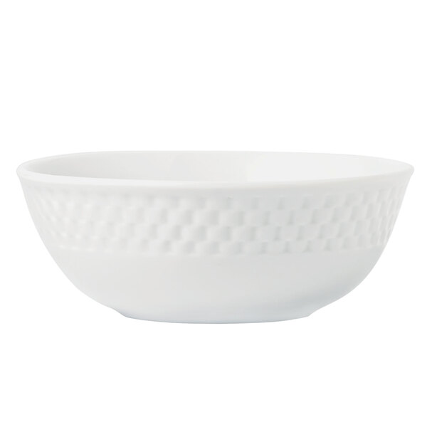 A close up of a Libbey Lunar Bright White Porcelain Cereal Bowl with a woven pattern.