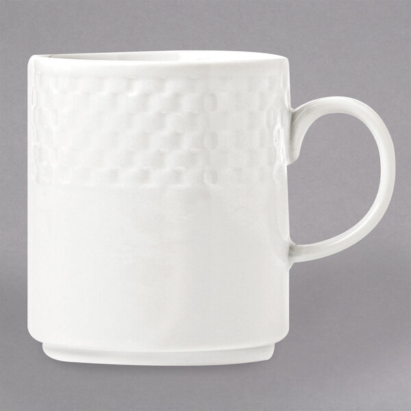 A white Libbey porcelain mug with a constellation pattern and white handle.