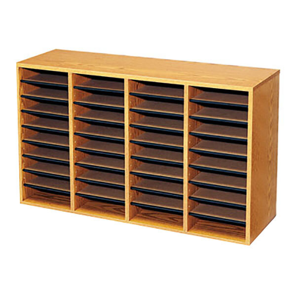 A Safco medium oak wooden file organizer with many compartments.