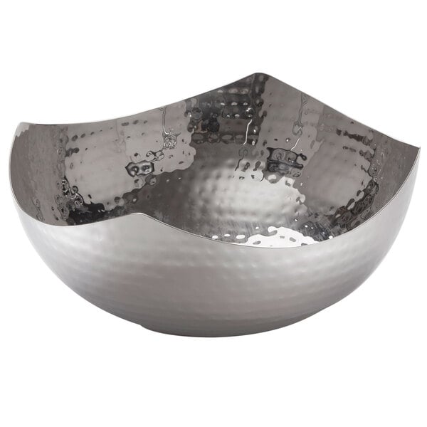 An American Metalcraft hammered stainless steel bowl with a wavy edge.