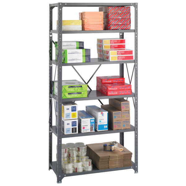 A Safco dark gray metal shelving unit holding many boxes.