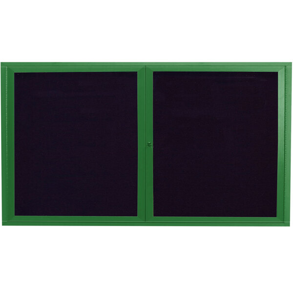 A green aluminum rectangular bulletin board with black trim and two doors with windows showing black letter board inside.