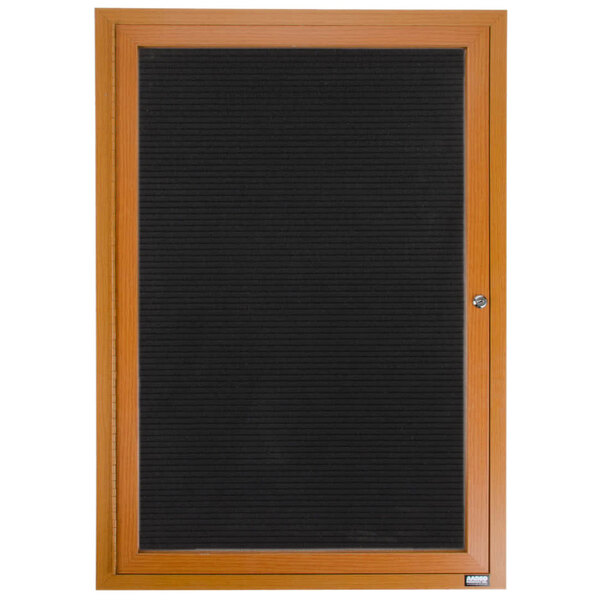 An Aarco indoor directory board with a wooden frame and felt rear panel.