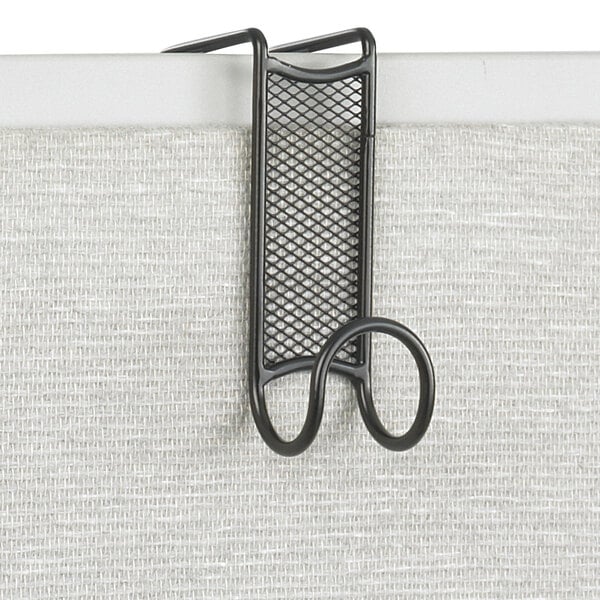 A black metal Safco coat hook over a white surface.
