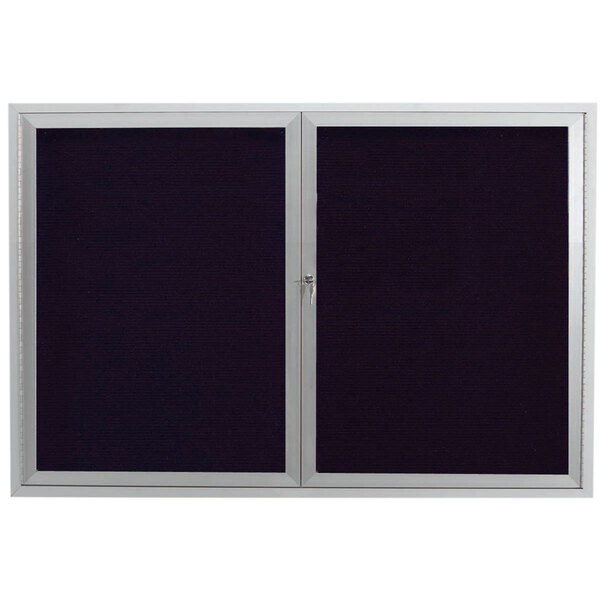 An Aarco outdoor directory board with two black and silver framed doors containing black letter board.