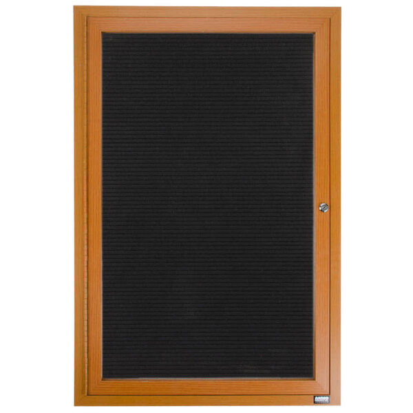 An Aarco enclosed directory board with an oak frame and felt panel on the door.