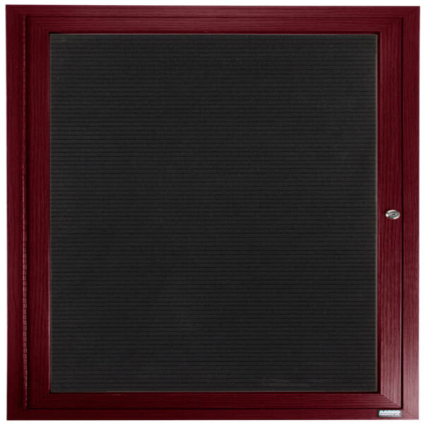 A cherry wood directory board with a black frame and a black felt panel.