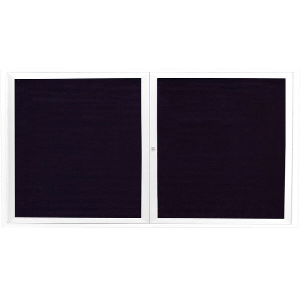 A white Aarco outdoor directory board with two black square windows.