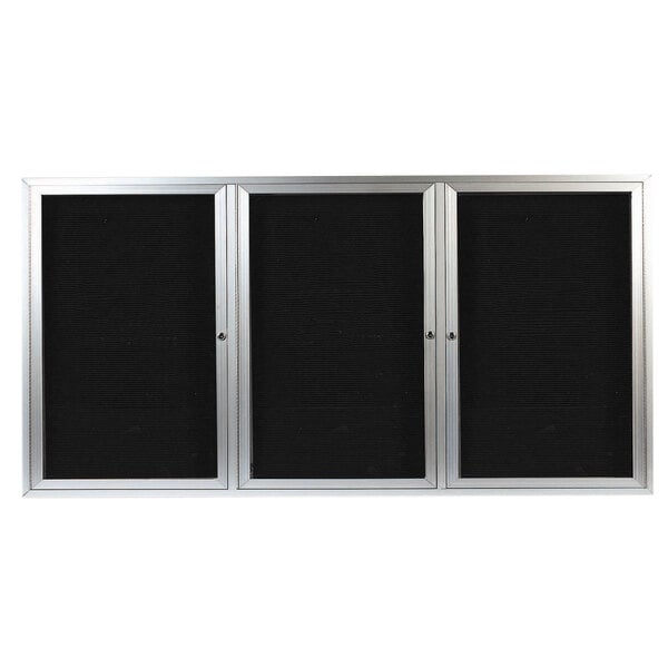 A black rectangular cabinet with three silver-framed glass doors.