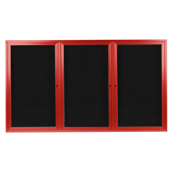 A red rectangular cabinet with black letter board panels inside.