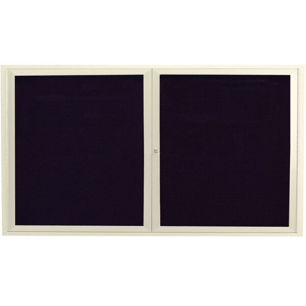 An ivory rectangular bulletin board with two black and white framed doors containing black letter boards.