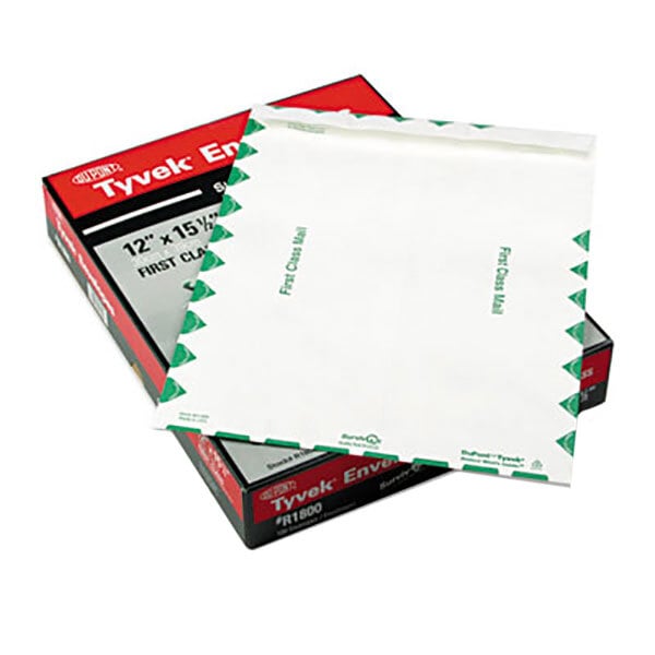 A box of white Survivor Tyvek envelopes with green trim.